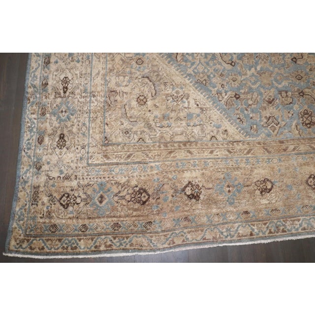 A 1920s Persian Mahal rug in blues and tan/khaji