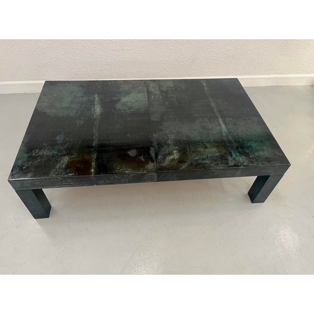 Beautiful coffee table in dark green lacquered goatskin. Typical of Aldo Tura's creations from the 1970s. This piece is...