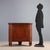 Directoire cherry corner cabinet from Emilia, dating back to the early 19th century. The structure features a central...