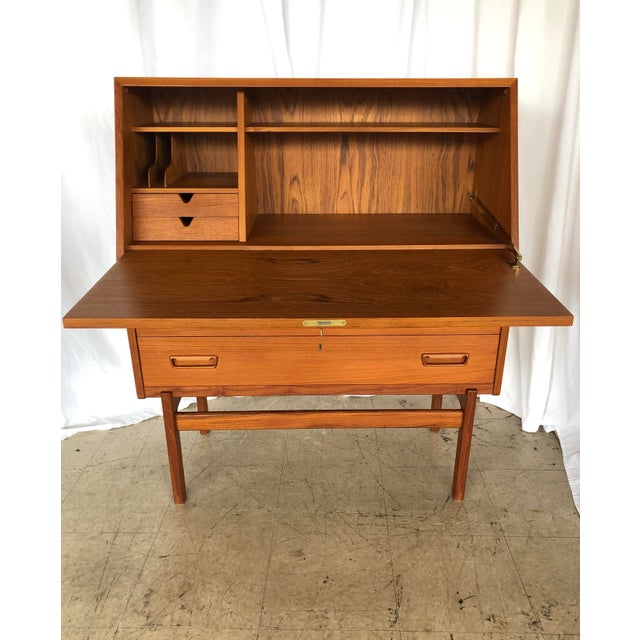 Exceptional all teak secretary designed by Arne Iverson for Vince Mobelfabrik. The original key unlocks fold-down front....