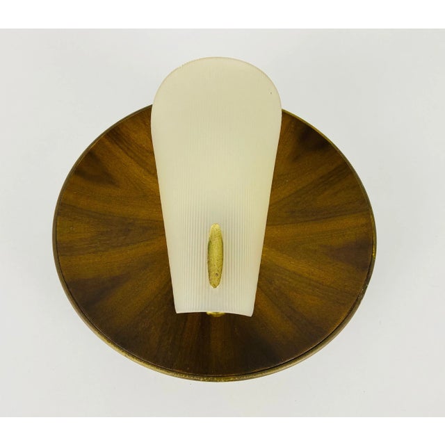 Italian wall lamp made in the 1960s in the style of Stilnovo. It is fascinating with its rare glass shape. The body of the...