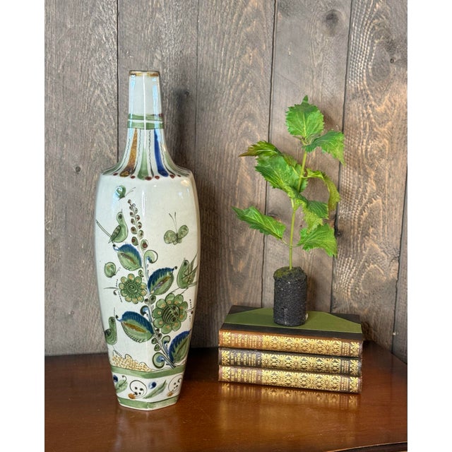 A striking monumental Mexican studio pottery vase, hand-painted in the Tonalá tradition with whimsical birds, butterflies,...