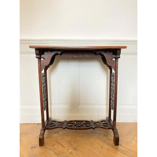 Nice late 19th century Japanese inspired lacquered side table. The top is finely lacquered and in relief, it is made of...