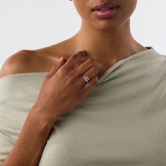 This elegant Mid Century engagement ring is a beautifully balanced design from the 1950’s, centered by a GIA-certified old...