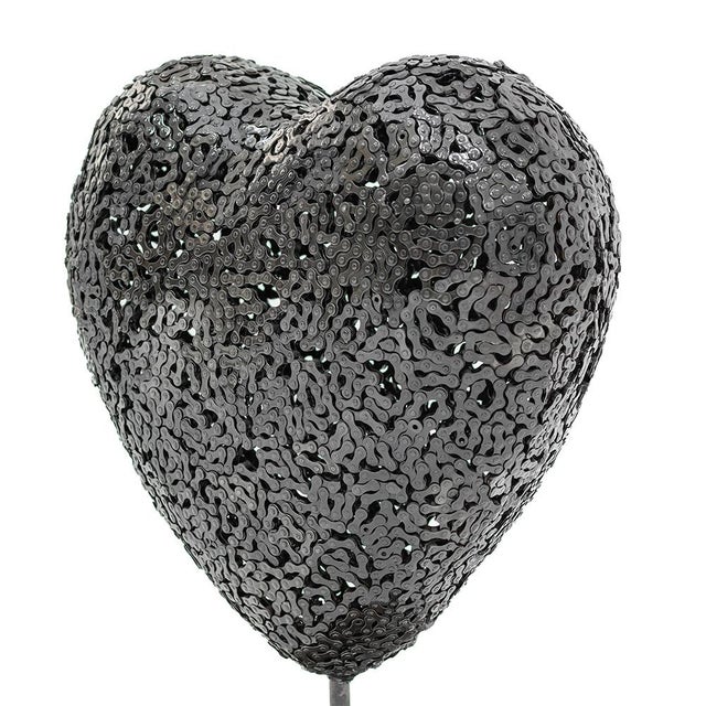 Two hearts made from the same material — yet each tells a different story. Where the steel gears heart speaks of...