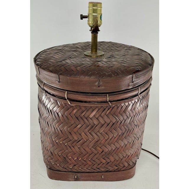 Hand made wicker lidded basket made into table lamp.