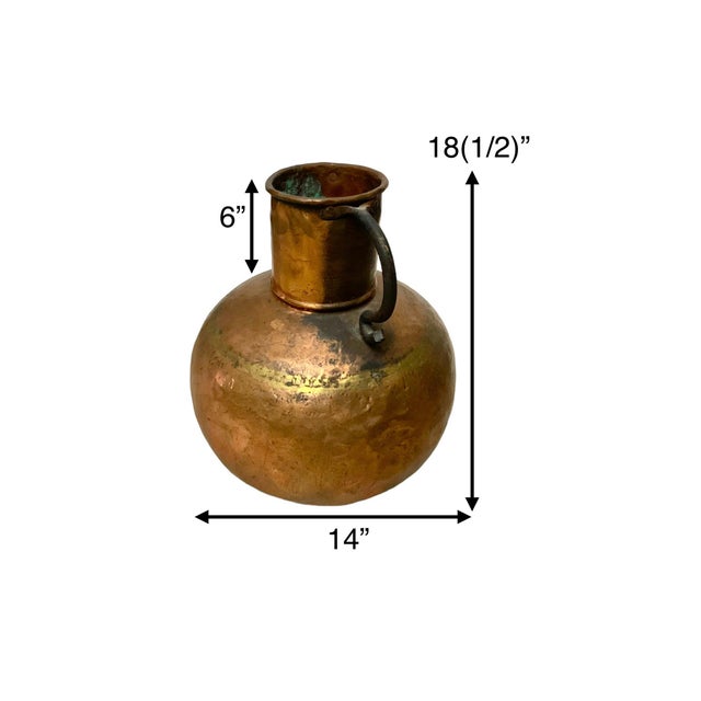 This vintage copper jug is a unique addition to any collection. Hand hammered with double handles, it is both functional...
