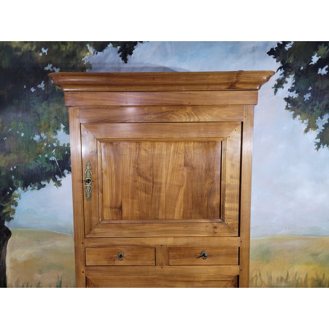 Standing man, Louis Philippe period, in solid cherry wood. This model is known as a "doucine" (cylindrical cornice),...