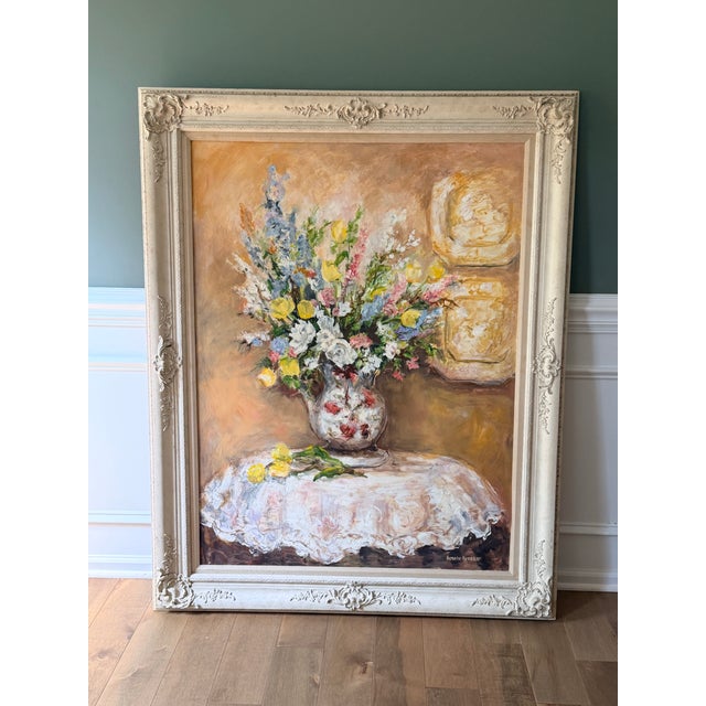 Beautiful vintage floral still-life oil painting featuring a lush arrangement of blue, yellow, white and pink flowers...
