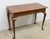 Writing Desk by Kittinger. Store item #554. It features banded top and three dovetailed drawers.