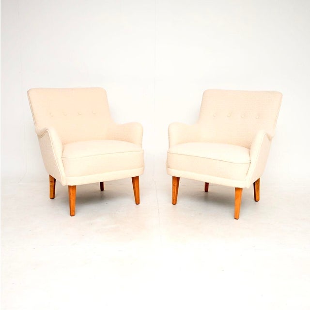 A stylish and extremely comfortable pair of vintage Swedish armchairs. They were recently imported from Sweden, they date...