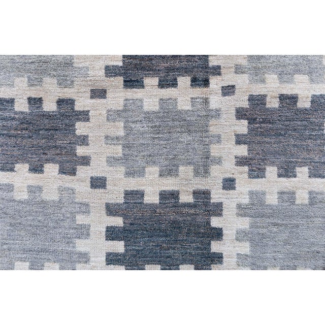 This modern Swedish pile rug offers a refined take on classic Scandinavian geometry, featuring an allover checkerboard...