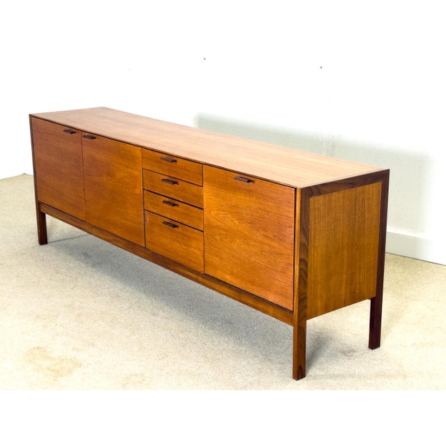 Mid-Century Sideboard with Brown Leather Handles by Meredew, 1960s, in Flawless conditions. Designed 1950 to 1959 This...