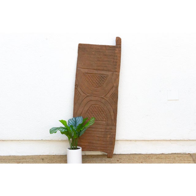 This 42-inch door (47.5 inches including its pivot tab) is a single-slab Dogon or Bamana piece from Mali, hand-hewn from...
