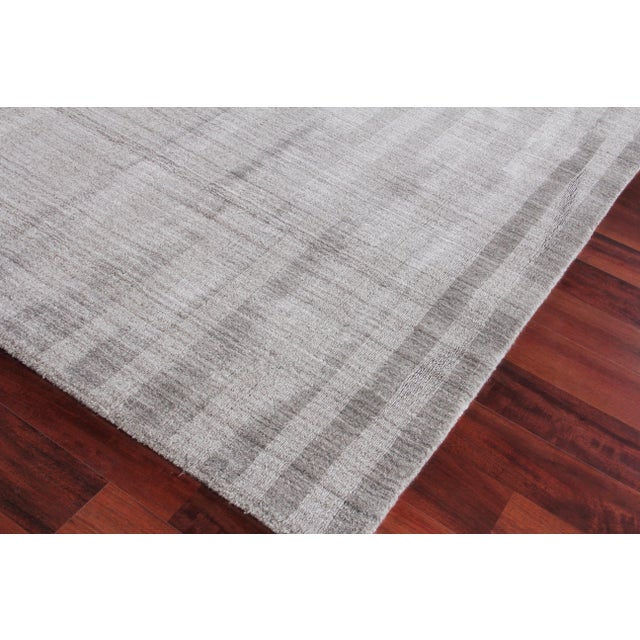 The linear tonal design of the Iscar rug is at once casual, chic and ultra sophisticated. Made of luxurious bamboo silk,...