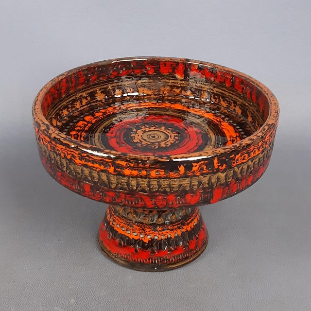 Stunning vintage majolica ceramic cake stand, made in Italy by Aldo Londi Bitossi, with intricate engravings and orange,...