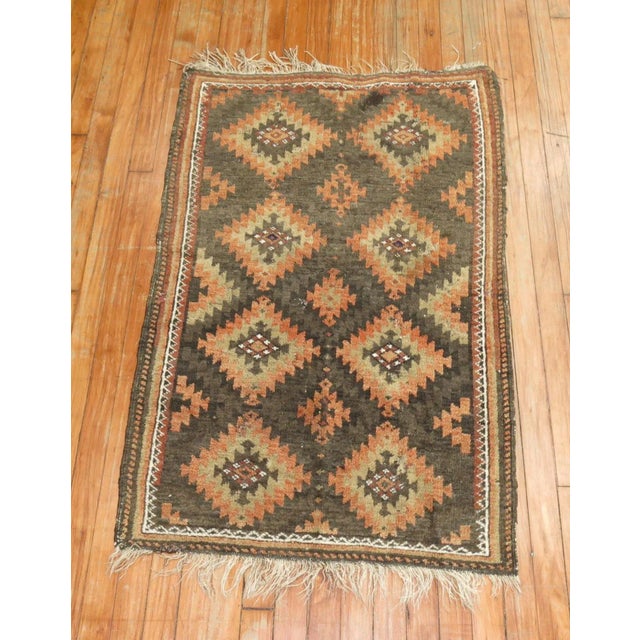 An early 20th Century small throw size tribal ersari rug. This piece is a true antique, one of a kind rug that has been...