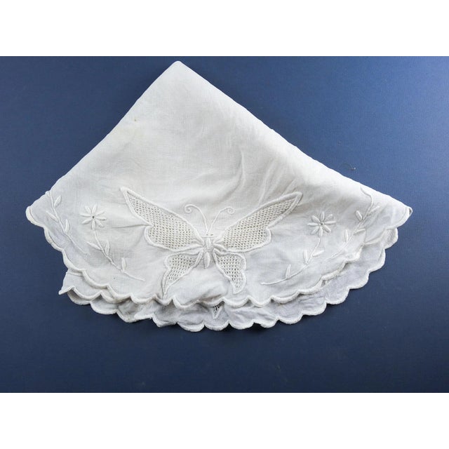 Vintage round hand emboidered whitework and openwork linen table cloth. Scalloped edges large butterflies and floral...