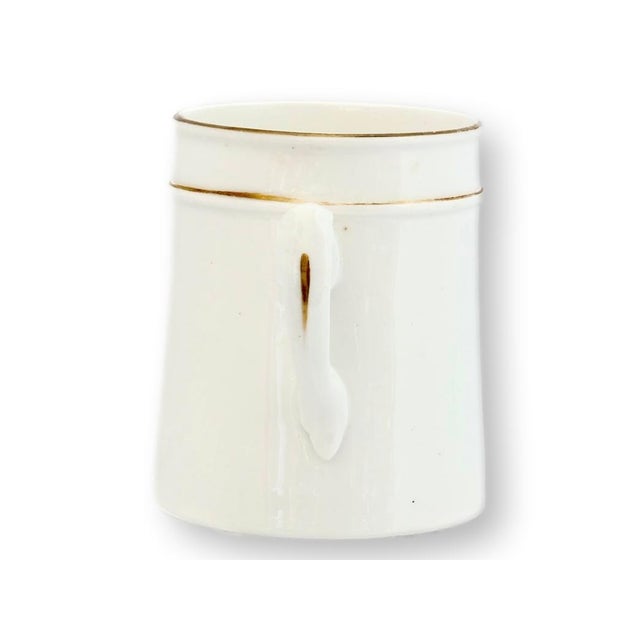 Late 19th century English porcelain mug decorated with floral garlands and the sentimental gilt inscription “For a Good...