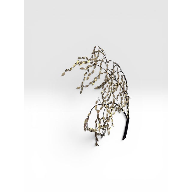 Graceful and organic, this vintage Mid-Century Modern wall sculpture captures the elegant movement of a cascading weeping...