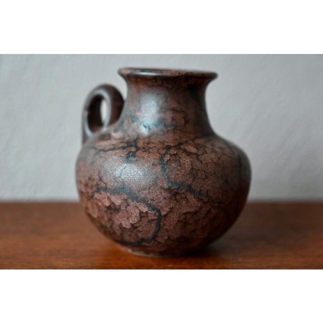 This vase, with thick and particular enamel, is a beautiful German production from the 60s. It comes from the Ruscha...