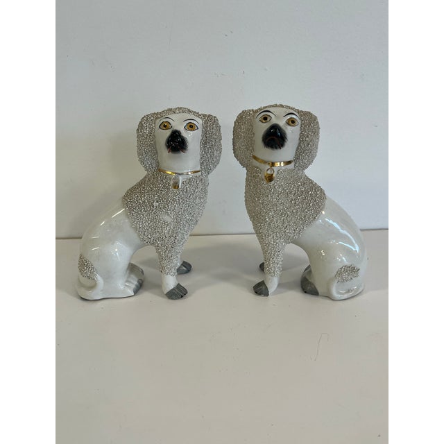 Adorable pair of Staffordshire pottery Poodles figures. Lovely size slightly smaller than what is usually seen.