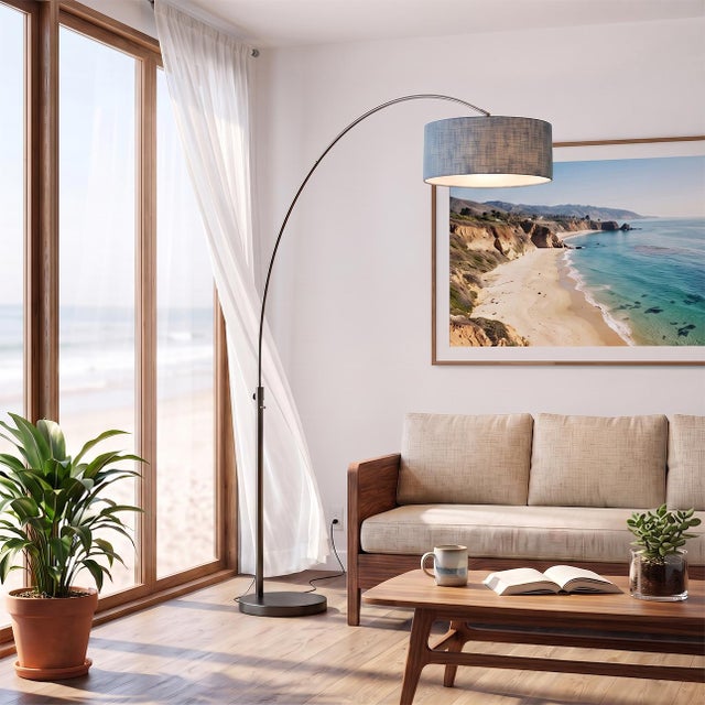 Designed by Peter Morelli in 1960, the Float Arc Lamp is a modern statement piece featuring a black nickel finish and a...