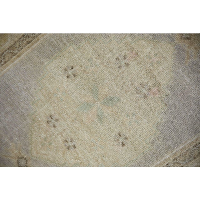 Introducing our exquisite vintage mini Turkish rug, expertly crafted by skilled artisans using traditional techniques that...