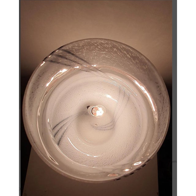 A fantastic and rare accent lamp, created in the legendary lighting ateliers "vistosi-murano, italy" in the 1950's, mouth...