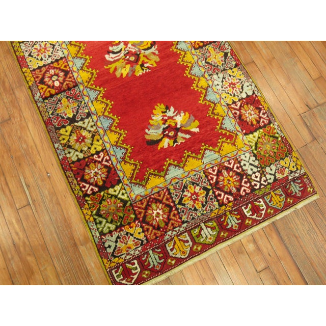 A one of a kind Turkish runner with a dazzling array of fruitful and bright colors and wild border. This piece was meant...