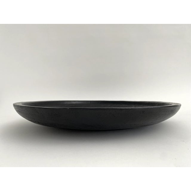 Stunning handcrafted ebonized wood bowl that was created from the horizontal/cross section of a tree. The grain of the...