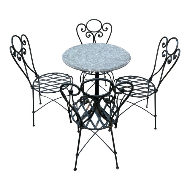 1990s Wrought Iron Decorative Patio Set Stone Top Table and 4 Chairs For Sale
