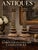 A pair of patinated metal candlesticks cast in the form of Neoclassical Corinthian columns featuring fluted shafts, ornate...