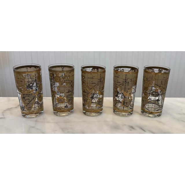 Cera “World Atlas” highball glasses featuring 22kt gold embellishments and an antique map design in excellent vintage...