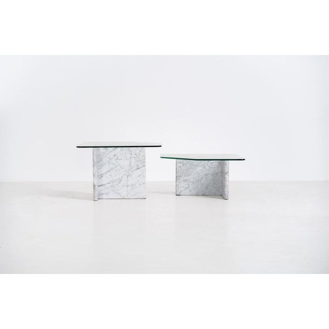 Marble & glass coffee tables (Italy, 1970s). A striking pair of coffee tables that perfectly balance weight and lightness....