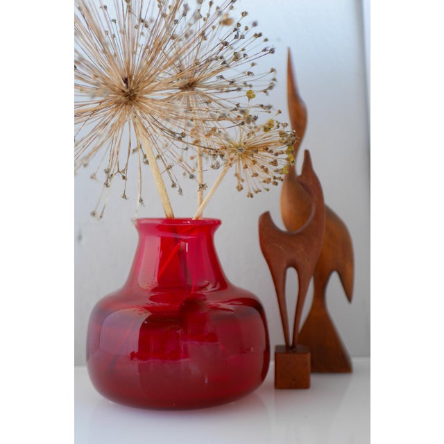 A fantastic and rare bright red glass vase made and signed by Erik Höglund, the master of architectural glass, a part of...