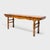 This antique Chinese offering table stands out for its grand scale, sculptural shape and vibrant finish of marigold-orange...