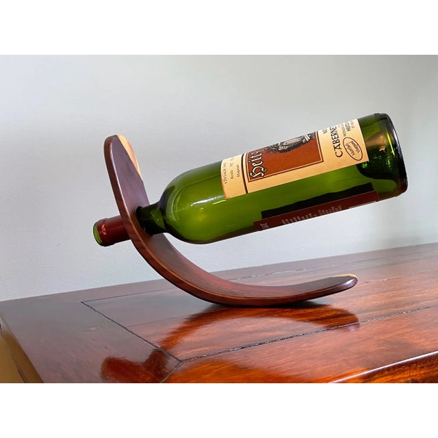 A beautiful complement to a wine counter or cellar, this cherry wood single bottle wine holder is makes a striking and...