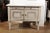 A Swedish painted wood sideboard from the late 19th century, with two drawers, two doors, canted side posts and tapered...