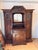 Design Plus Gallery presents a 19th Century French Henry II Style Oak Hunt Cabinet. This antique cabinet displays...