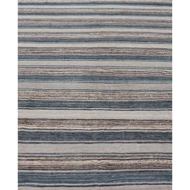 Versatile and natural blue, cream, and brown flat-weave Kilim for a modern or classic design. Flat-weave Kilim rug with...