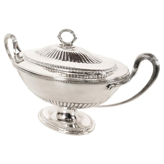 A fine antique Georgian sterling silver twin handled soup tureen and cover by the Royal Gold and Silversmith Benjamin...