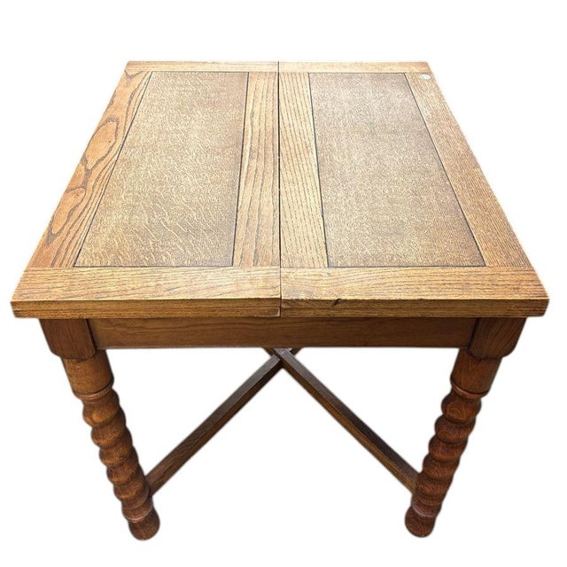 This Antique pub draw-leaf Barley Twist Solid Wood Table is a timeless piece of furniture crafted from solid oak material....