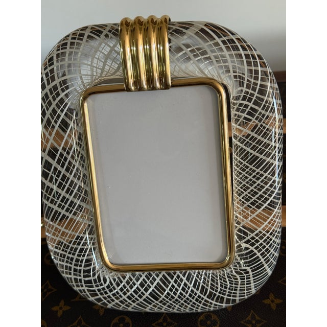 This magnificent vertical photo frame is purely in the tradition of Venetian glassmaking. The technique used to achieve...