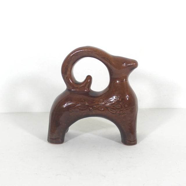 Mid century modern pottery ram or goat in a rust brown colour. Bitossi style. No damage detected. 5” long 5.5” tall 2.5” deep