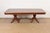 An exceptional Italian Regency style double pedestal dining table In the manner of Baker Furniture USA, Circa Late 20th...