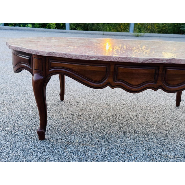 Vintage 1960s Provincial Pink Oval Marble Top Coffee Table Bring timeless elegance and vintage charm to your home with...