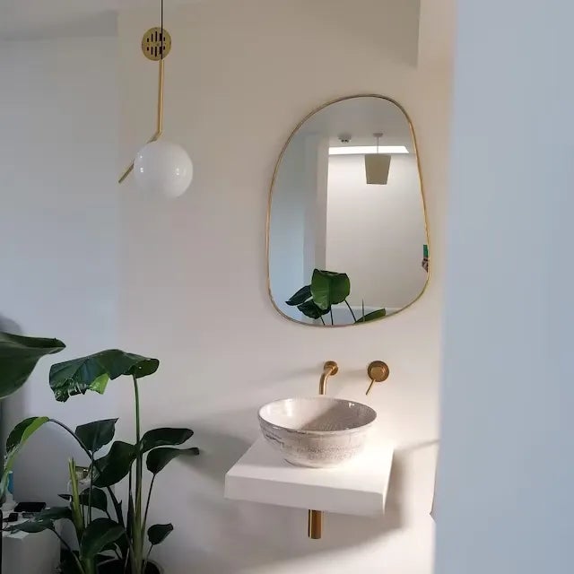 "Add a touch of bohemian chic to your home with this handmade brass mirror from Marrakech. Made with brass and natural...