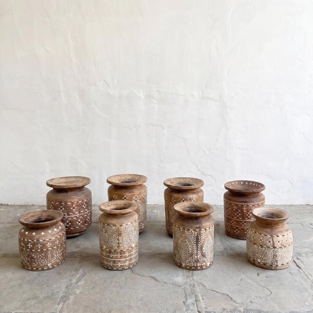 A vintage handcrafted wooden decorative pot featuring intricate hand-cut bone inlay in traditional floral and geometric...
