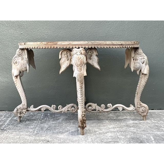 This magnificent side table is a triumph of traditional South Asian craftsmanship, featuring four expertly hand-carved...